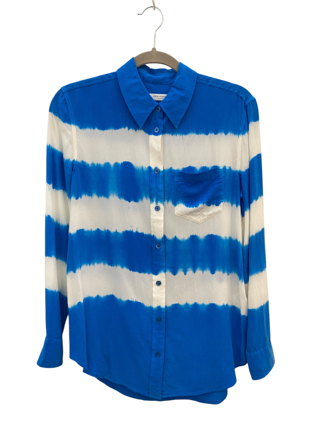 Blue and white striped shirt on a hanger against a white background
